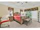 This bedroom boasts a tray ceiling, an upholstered chair, and lots of natural light at 765 Shaftesbury Ln., Conway, SC 29526