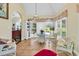 Bright breakfast nook with a glass table, wicker chairs, and views of the outdoors at 765 Shaftesbury Ln., Conway, SC 29526