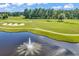 An aerial view showing a water fountain on a golf course at 765 Shaftesbury Ln., Conway, SC 29526