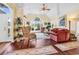 Bright living room boasts vaulted ceilings, hardwood floors, and a large arched window at 765 Shaftesbury Ln., Conway, SC 29526
