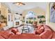 Spacious living room with hardwood floors, fireplace, and views of the outdoors at 765 Shaftesbury Ln., Conway, SC 29526