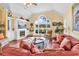 Comfortable living room featuring a fireplace and large window with golf course views at 765 Shaftesbury Ln., Conway, SC 29526