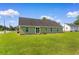 Exterior of home showcasing the grassy backyard at 943 Oak St., Aynor, SC 29511
