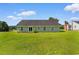 Backyard featuring grassy yard and the exterior of the house at 943 Oak St., Aynor, SC 29511