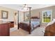 Comfortable bedroom with a ceiling fan, lots of natural light, and neutral-colored walls and carpet at 943 Oak St., Aynor, SC 29511