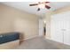 Bedroom with carpeted floors, a ceiling fan, and a closet with double doors at 943 Oak St., Aynor, SC 29511