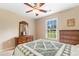A quaint bedroom with wood dressers and bright natural light through the window at 943 Oak St., Aynor, SC 29511