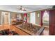 Comfortable living room featuring hardwood floors, a ceiling fan, and a warm, inviting atmosphere at 943 Oak St., Aynor, SC 29511