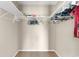 Organized walk-in closet with shelves and rods, offering ample storage space for clothes and accessories at 943 Oak St., Aynor, SC 29511