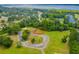 A scenic aerial shot shows a vacant lot amongst a lush green neighborhood with waterfront views at Lot 142 Millbank Rd., Georgetown, SC 29440