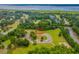 Aerial view of lot surrounded by mature trees and landscaping near waterfront at Lot 142 Millbank Rd., Georgetown, SC 29440