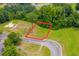 An aerial view of an empty lot nestled among lush trees and landscaping at Lot 142 Millbank Rd., Georgetown, SC 29440