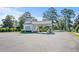 Welcoming entrance to South Island Plantation with classic architecture and lush landscaping at Lot 142 Millbank Rd., Georgetown, SC 29440