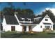 Charming white home with a stone-accented porch and a dark, shingled roof at Lot 142 Millbank Rd., Georgetown, SC 29440