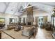 Spacious living room with a stone fireplace, neutral-toned furniture, and plenty of natural light at Lot 142 Millbank Rd., Georgetown, SC 29440