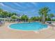 Beautiful community pool with a clear blue water, ample seating, and lush landscaping at Lot 142 Millbank Rd., Georgetown, SC 29440