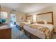 Bright bedroom with two beds and a balcony at 1105 S Ocean Blvd. # 128, Myrtle Beach, SC 29577