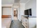 Bedroom featuring a comfortable bed, dresser, and convenient access to the hallway at 1105 S Ocean Blvd. # 128, Myrtle Beach, SC 29577