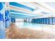 Well-lit indoor pool area featuring tiled floors, large windows, and comfortable lounging at 1105 S Ocean Blvd. # 128, Myrtle Beach, SC 29577