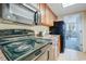 Compact kitchen equipped with appliances and granite countertops at 1105 S Ocean Blvd. # 128, Myrtle Beach, SC 29577