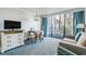 A comfortable living area with balcony access at 1105 S Ocean Blvd. # 128, Myrtle Beach, SC 29577