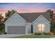 Charming single-story home with blue siding, a two-car garage, and a well-manicured lawn at 1237 Beeblossom Dr., North Myrtle Beach, SC 29582