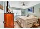 Cozy bedroom with a comfortable bed, wood-look flooring and plenty of natural light at 1301 Pridgen Rd. # 903, Myrtle Beach, SC 29577