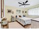 Charming bedroom with ceiling fan, and a cozy rug to compliment the wood flooring at 1301 Pridgen Rd. # 903, Myrtle Beach, SC 29577