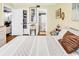 Bedroom with closet, ensuite bathroom, light colored walls, and wood look vinyl flooring at 1301 Pridgen Rd. # 903, Myrtle Beach, SC 29577