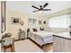 Charming bedroom with ceiling fan, and a cozy rug to compliment the wood flooring at 1301 Pridgen Rd. # 903, Myrtle Beach, SC 29577