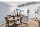 Open dining area features a wooden table and is adjacent to the bright kitchen at 1301 Pridgen Rd. # 903, Myrtle Beach, SC 29577