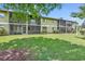 Building exterior with large, screened patio, providing an outdoor living space and beautiful curb appeal at 1301 Pridgen Rd. # 903, Myrtle Beach, SC 29577