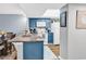 Updated kitchen open to dining area with granite counters and blue cabinets at 1301 Pridgen Rd. # 903, Myrtle Beach, SC 29577