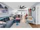 Open-concept living room with dining area, modern light fixtures, and stylish decor at 1301 Pridgen Rd. # 903, Myrtle Beach, SC 29577
