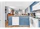 Bright kitchen features granite counters, white appliances, and is open to living area at 1301 Pridgen Rd. # 903, Myrtle Beach, SC 29577