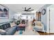 Open-concept living room with dining area, modern light fixtures, and stylish decor at 1301 Pridgen Rd. # 903, Myrtle Beach, SC 29577