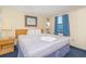 Cozy bedroom with a comfortable bed, side table, and a relaxing ambiance at 1304 N Ocean Blvd. # 200, Myrtle Beach, SC 29577