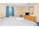 Bright bedroom includes a bed, dresser, and a window offering an outside view at 1304 N Ocean Blvd. # 200, Myrtle Beach, SC 29577