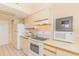 Well-equipped kitchen features ample cabinet space, white appliances, and a security safe at 1304 N Ocean Blvd. # 200, Myrtle Beach, SC 29577