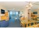 Bright condo living room with dining area, comfy seating, ocean view, and modern amenities at 1304 N Ocean Blvd. # 200, Myrtle Beach, SC 29577