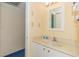 Compact bathroom featuring a vanity with sink, white cabinetry, and a well-lit mirror at 1304 N Ocean Blvd. # 505, Myrtle Beach, SC 29577