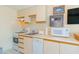 Kitchen with white cabinets, and appliances at 1304 N Ocean Blvd. # 505, Myrtle Beach, SC 29577