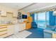 Compact kitchen with ocean view and adjacent living area at 1304 N Ocean Blvd. # 505, Myrtle Beach, SC 29577