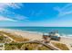 An ocean view featuring a pier with restaurants and beach goers at 1304 N Ocean Blvd. # 505, Myrtle Beach, SC 29577