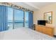 Bedroom showcasing oceanfront views through sliding glass doors at 1304 N Ocean Blvd. # S-307, Myrtle Beach, SC 29577