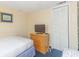 Bedroom featuring a TV, dresser, and closet at 1304 N Ocean Blvd. # S-307, Myrtle Beach, SC 29577