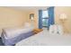 Bedroom with twin beds and nightstand at 1304 N Ocean Blvd. # S-307, Myrtle Beach, SC 29577