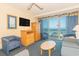 Comfortable living room featuring a tv, dining area, and ocean views at 1304 N Ocean Blvd. # S-307, Myrtle Beach, SC 29577