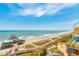 Stunning aerial view showcasing the beach, pier, and nearby attractions at 1304 N Ocean Blvd. # S-501, Myrtle Beach, SC 29577