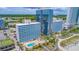 Breathtaking aerial view of oceanfront resort with pools, palm trees, and boardwalk access to the beach at 1304 N Ocean Blvd. # S-501, Myrtle Beach, SC 29577